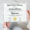 Accomplished Woman Holding white High School Diploma Certificate with black framing