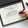 Virtual wedding certificate replica being officially signed and displayed in a high-quality certificate holder.