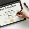 Hand signing a high school graduation diploma
